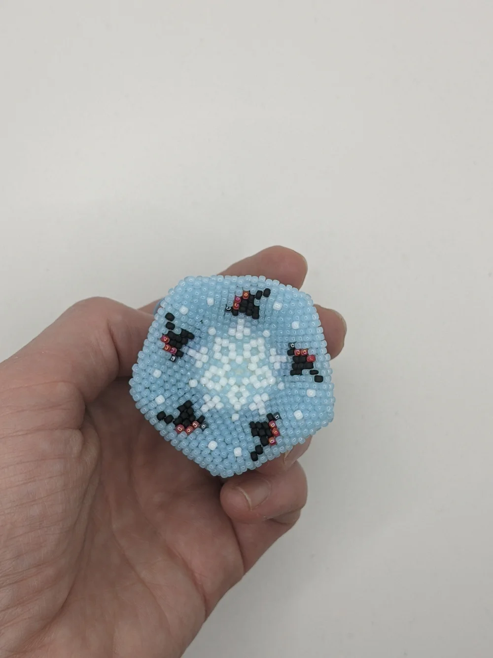 Handcrafted Light Blue Beaded Bell Ornament with Floral Accents